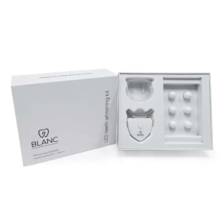 LED teeth whitening kit with mouthpiece and capsules.