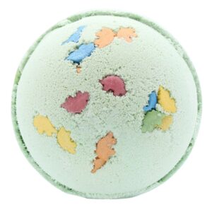 Green bath bomb with colourful dinosaur shapes