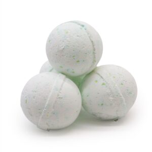 Stack of white bath bombs with green specks
