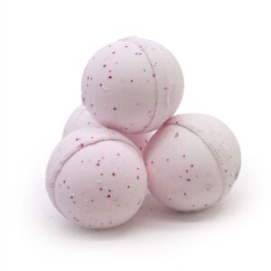 Pink speckled bath bombs stacked together